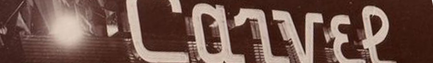White sign with black letters spelling out "LOVER."